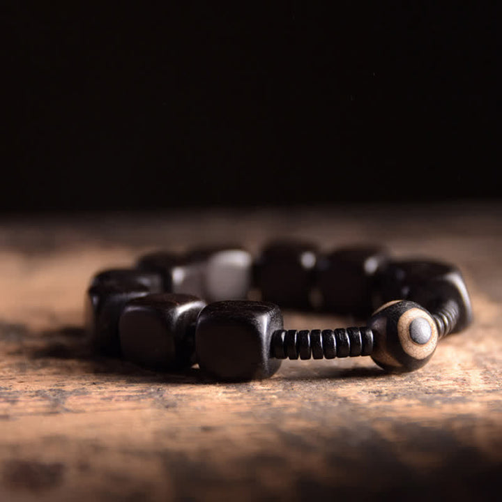 BWOOOH Tibetan Ebony Wood Dzi Bead Strength Bracelet  -  Ebony Tibetan bracelet for spiritual healing and mindful living