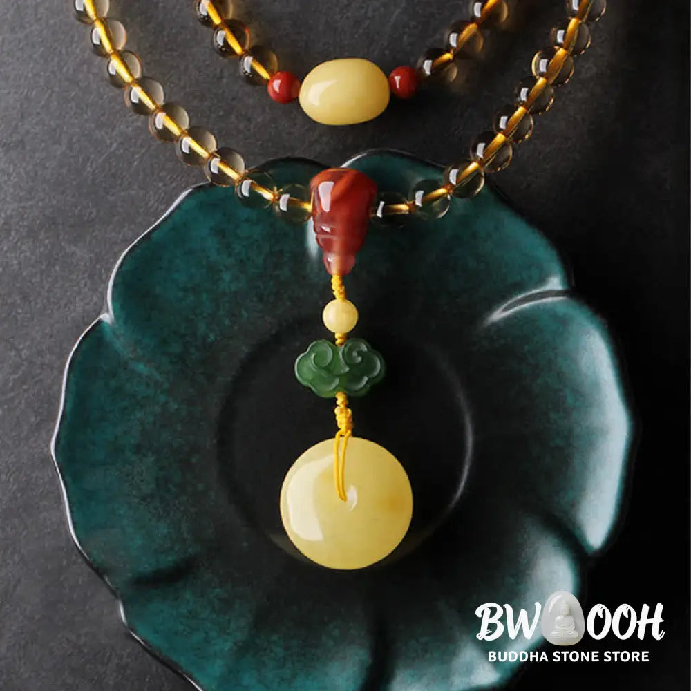 BWOOOH 108 Mala Beads bracelet featuring polished natural citrine, golden amber, and deep red agate, interspersed with a round peace buckle and a detailed gold-toned PiXiu charm on premium elastic string for wealth attraction and emotional balance. - View 7