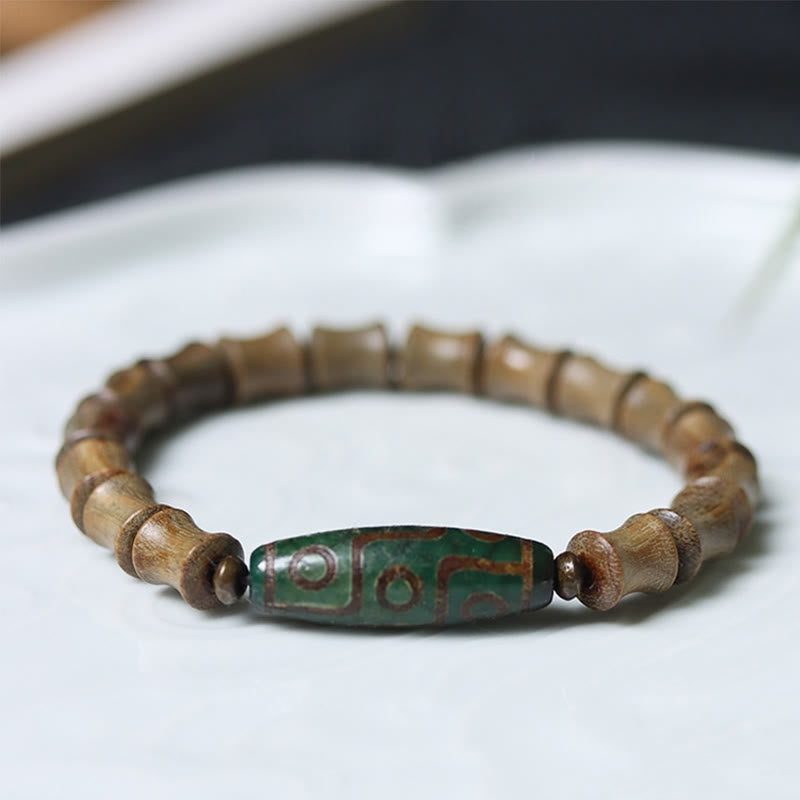 BWOOOH Tibetan Nine-Eye Dzi Bead Green Sandalwood Peace Bracelet — Dzi Tibetan bracelet for spiritual healing and mindful ...