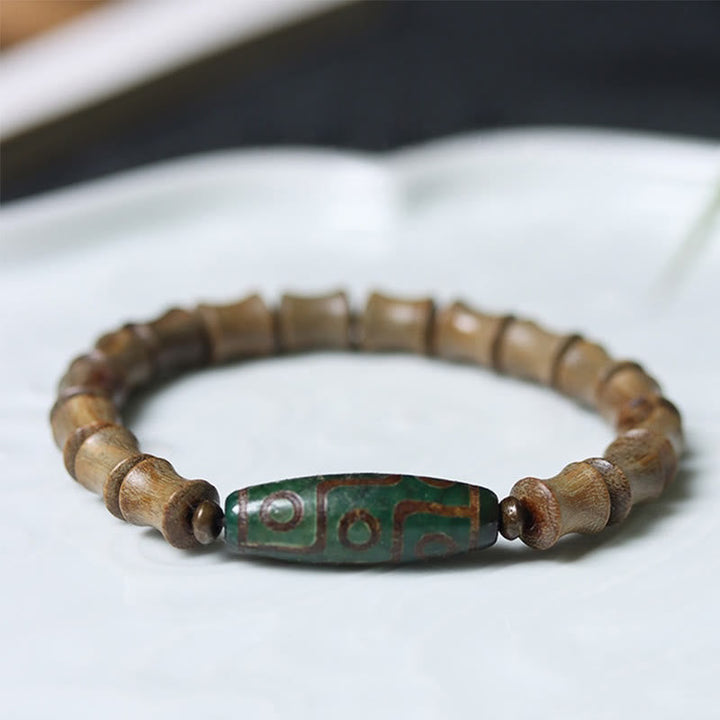 BWOOOH Tibetan Nine-Eye Dzi Bead Green Sandalwood Peace Bracelet — Dzi Tibetan bracelet for spiritual healing and mindful ...