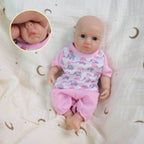 Luna 8-inch solid silicone baby doll, water-safe, with movable limbs and soft, lifelike features.