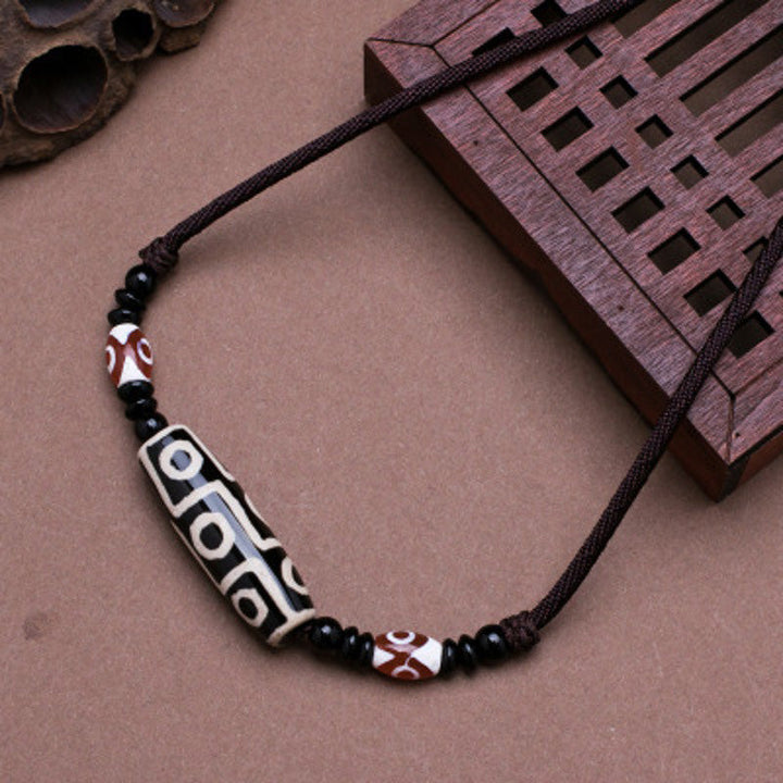 BWOOOH Tibetan Nine-Eye Dzi Bead protection string necklace — sacred dzi bead necklace and Buddhist amulet for wealth and wisdom