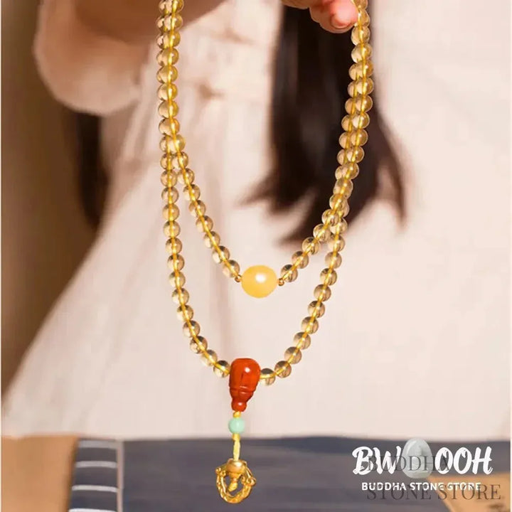 BWOOOH 925 Sterling Silver 108 Mala Beads bracelet, featuring polished 6mm and 8mm natural Citrine, Red Agate, and Amber, with sterling silver accents on a premium elastic string, designed for meditation and spiritual well-being. - View 2