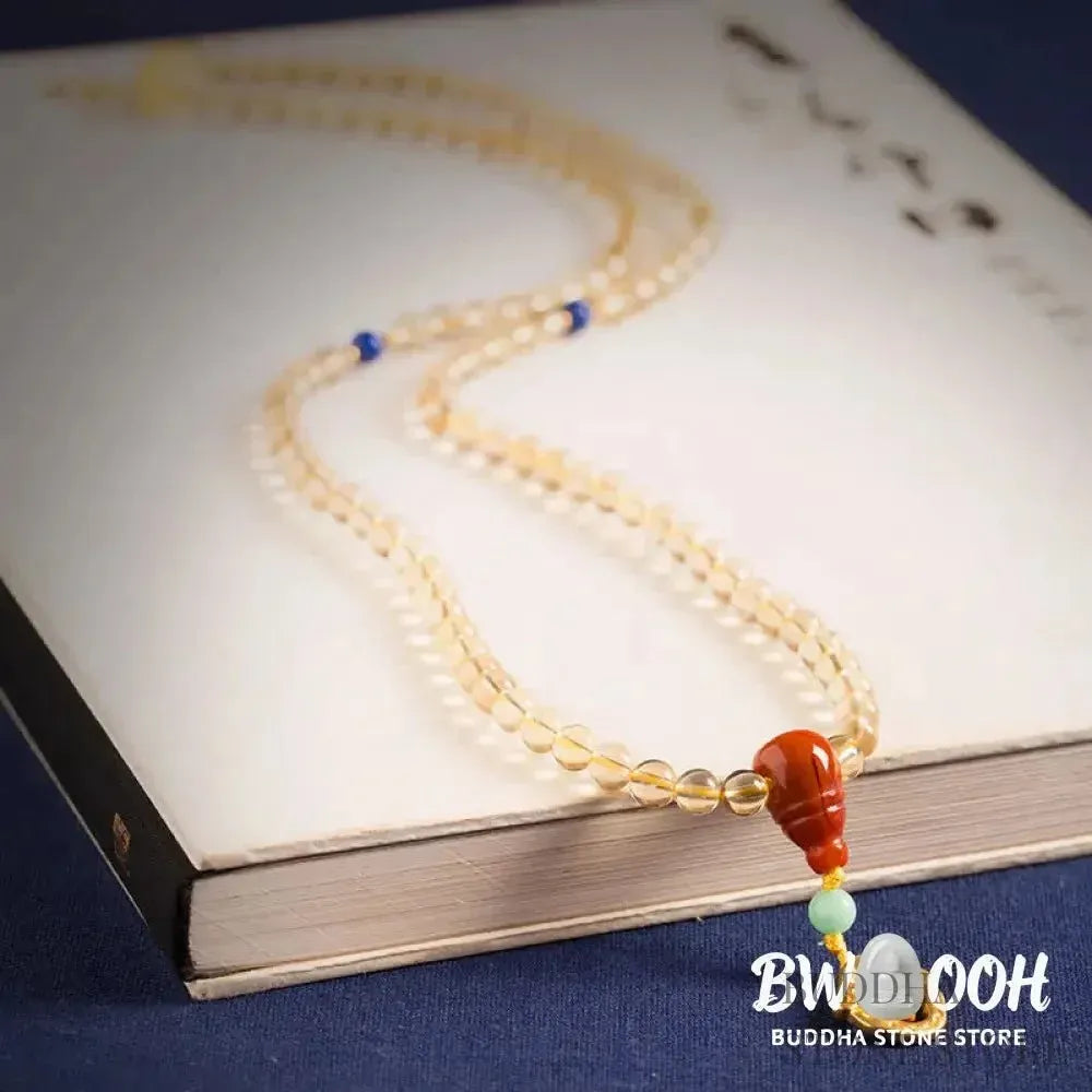 BWOOOH 925 Sterling Silver 108 Mala Beads bracelet, featuring polished 6mm and 8mm natural Citrine, Red Agate, and Amber, with sterling silver accents on a premium elastic string, designed for meditation and spiritual well-being. - View 9
