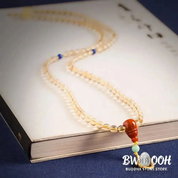 BWOOOH 925 Sterling Silver 108 Mala Beads bracelet, featuring polished 6mm and 8mm natural Citrine, Red Agate, and Amber, with sterling silver accents on a premium elastic string, designed for meditation and spiritual well-being. - View 9
