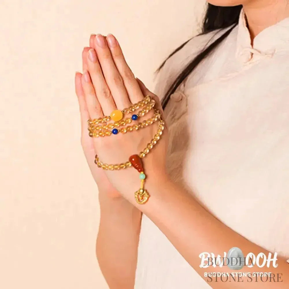 BWOOOH 925 Sterling Silver 108 Mala Beads bracelet, featuring polished 6mm and 8mm natural Citrine, Red Agate, and Amber, with sterling silver accents on a premium elastic string, designed for meditation and spiritual well-being. - View 6