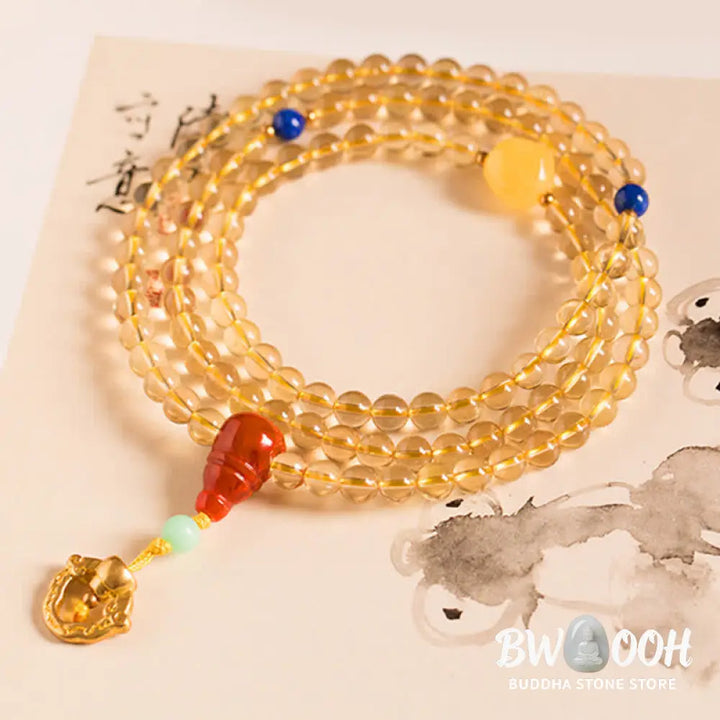 BWOOOH 925 Sterling Silver 108 Mala Beads bracelet, featuring polished 6mm and 8mm natural Citrine, Red Agate, and Amber, with sterling silver accents on a premium elastic string, designed for meditation and spiritual well-being. - View 12
