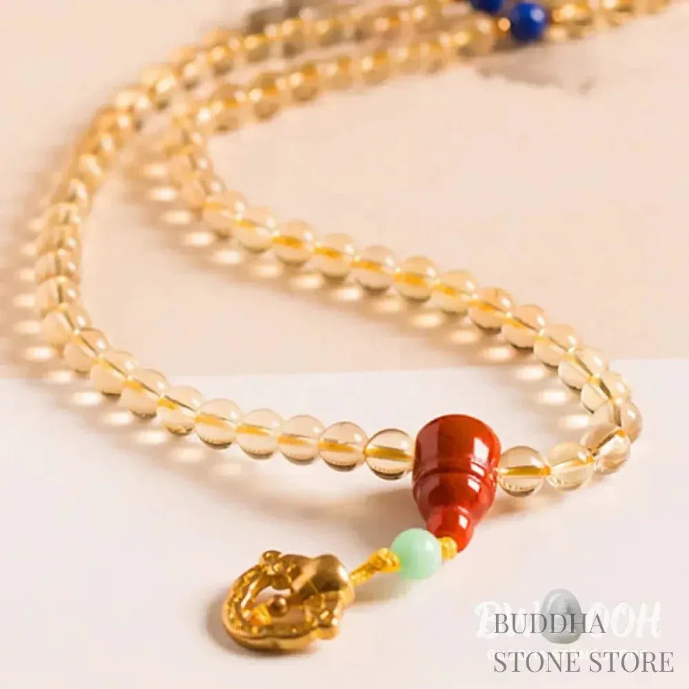 BWOOOH 925 Sterling Silver 108 Mala Beads bracelet, featuring polished 6mm and 8mm natural Citrine, Red Agate, and Amber, with sterling silver accents on a premium elastic string, designed for meditation and spiritual well-being. - View 10