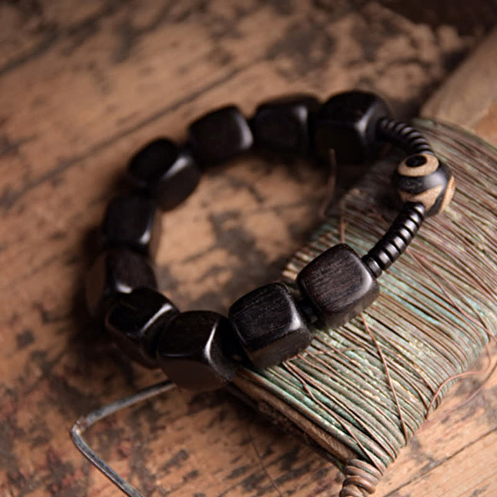 BWOOOH Tibetan Ebony Wood Dzi Bead Strength Bracelet  -  Ebony Tibetan bracelet for spiritual healing and mindful living