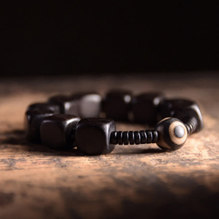 BWOOOH Tibetan Ebony Wood Dzi Bead Strength Bracelet  -  Ebony Tibetan bracelet for spiritual healing and mindful living