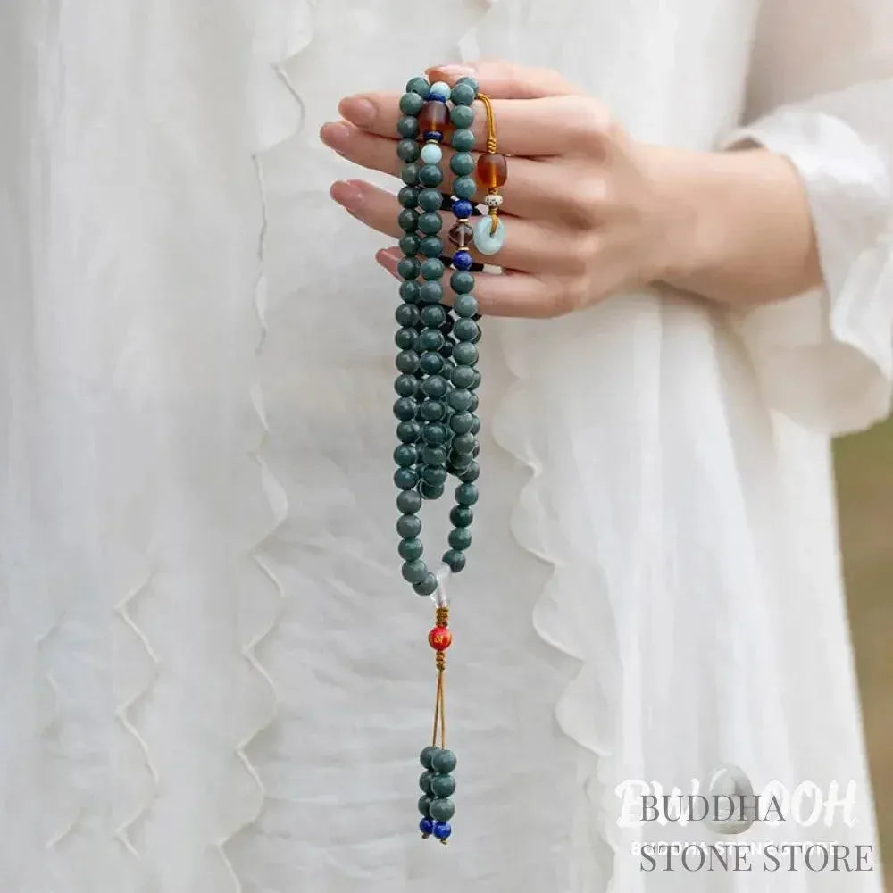 BWOOOH 108-bead Bodhi Seed meditation mala bracelet, featuring 8mm dark-speckled Bodhi seeds interspersed with vibrant red Cinnabar, rich green Jade, and golden Citrine accents. Designed for mindfulness, spiritual balance, and positive energy on a 90cm strand, worn five circles on a wrist. - View 3