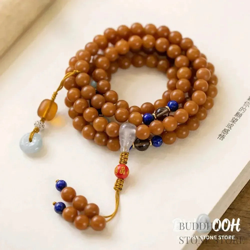 BWOOOH 108-bead Bodhi Seed meditation mala bracelet, featuring 8mm dark-speckled Bodhi seeds interspersed with vibrant red Cinnabar, rich green Jade, and golden Citrine accents. Designed for mindfulness, spiritual balance, and positive energy on a 90cm strand, worn five circles on a wrist. - View 7