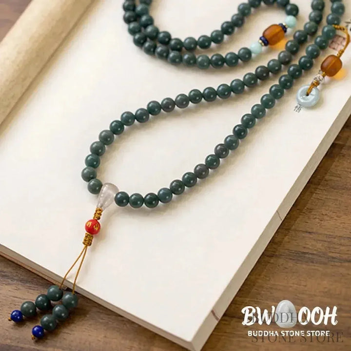 BWOOOH 108-bead Bodhi Seed meditation mala bracelet, featuring 8mm dark-speckled Bodhi seeds interspersed with vibrant red Cinnabar, rich green Jade, and golden Citrine accents. Designed for mindfulness, spiritual balance, and positive energy on a 90cm strand, worn five circles on a wrist. - View 5