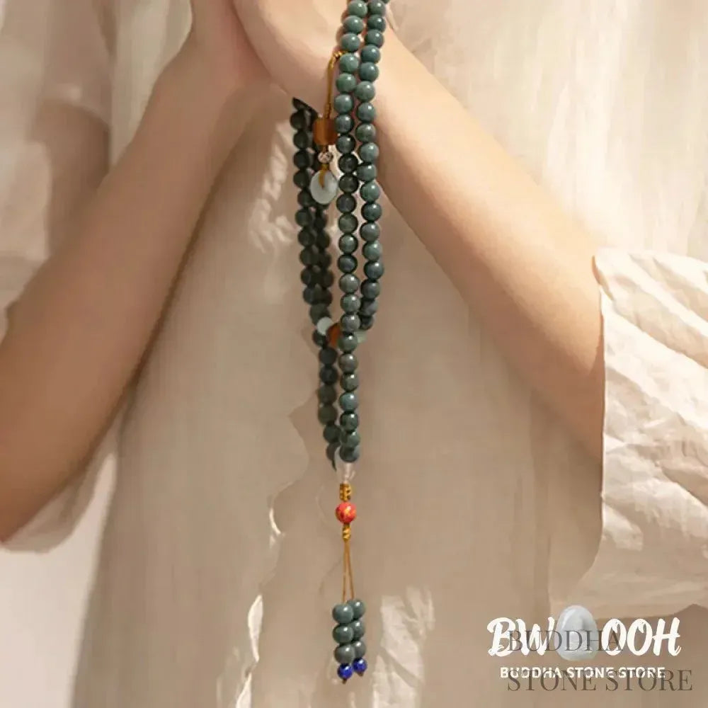 BWOOOH 108-bead Bodhi Seed meditation mala bracelet, featuring 8mm dark-speckled Bodhi seeds interspersed with vibrant red Cinnabar, rich green Jade, and golden Citrine accents. Designed for mindfulness, spiritual balance, and positive energy on a 90cm strand, worn five circles on a wrist. - View 2