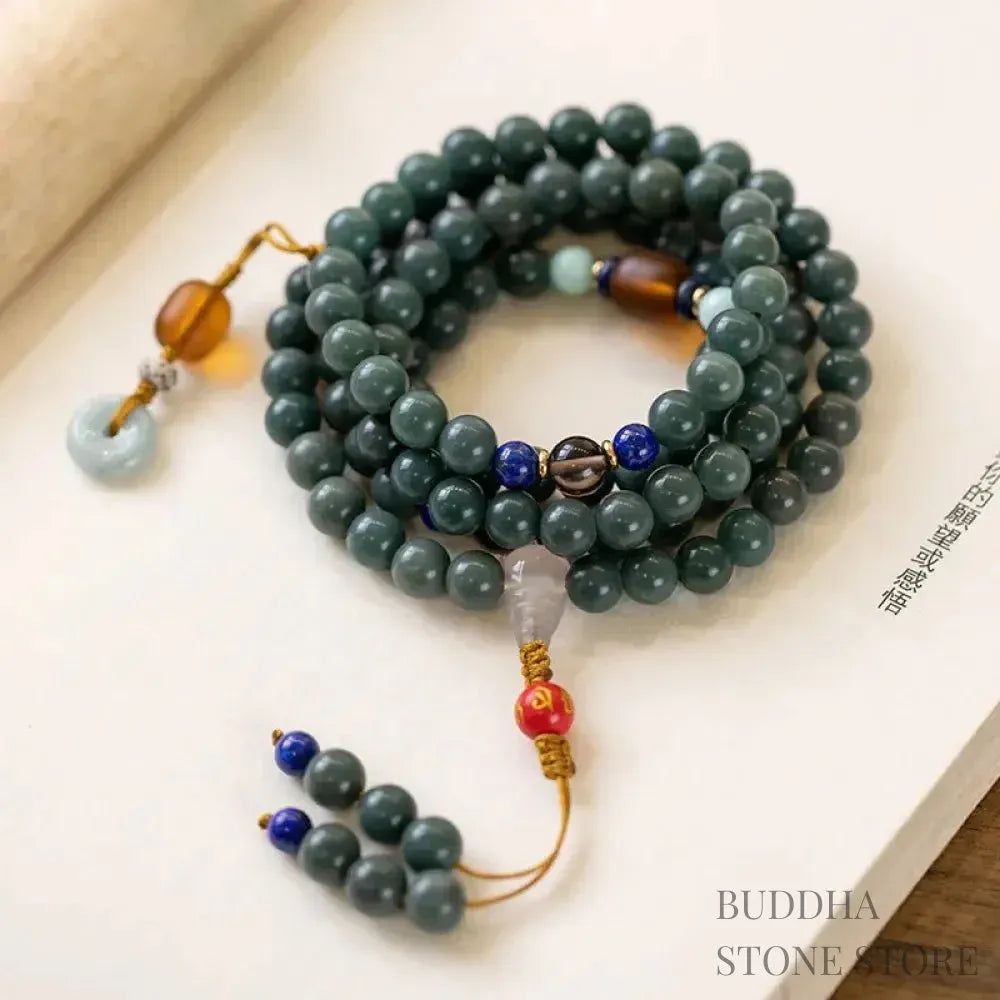 BWOOOH 108-bead Bodhi Seed meditation mala bracelet, featuring 8mm dark-speckled Bodhi seeds interspersed with vibrant red Cinnabar, rich green Jade, and golden Citrine accents. Designed for mindfulness, spiritual balance, and positive energy on a 90cm strand, worn five circles on a wrist.