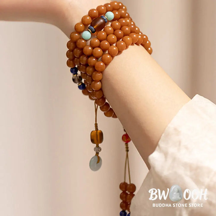 BWOOOH 108-bead Bodhi Seed meditation mala bracelet, featuring 8mm dark-speckled Bodhi seeds interspersed with vibrant red Cinnabar, rich green Jade, and golden Citrine accents. Designed for mindfulness, spiritual balance, and positive energy on a 90cm strand, worn five circles on a wrist. - View 8