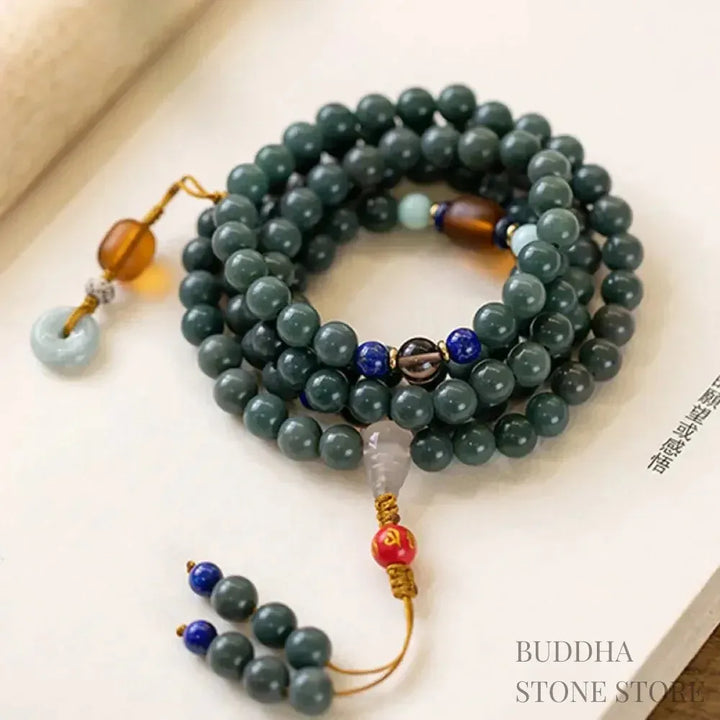 BWOOOH 108-bead Bodhi Seed meditation mala bracelet, featuring 8mm dark-speckled Bodhi seeds interspersed with vibrant red Cinnabar, rich green Jade, and golden Citrine accents. Designed for mindfulness, spiritual balance, and positive energy on a 90cm strand, worn five circles on a wrist. - View 4