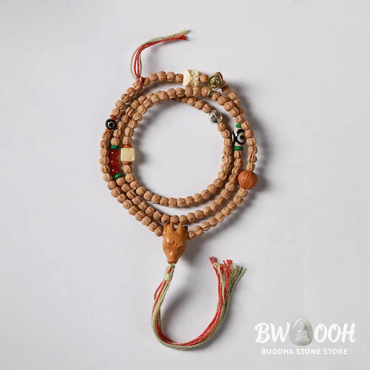 BWOOOH 108-bead Wisdom Mala bracelet featuring natural dark Bodhi Seeds, vibrant red agate beads, and a detailed deer head charm, displayed on a serene background, perfect for meditation and spiritual balance. - View 15