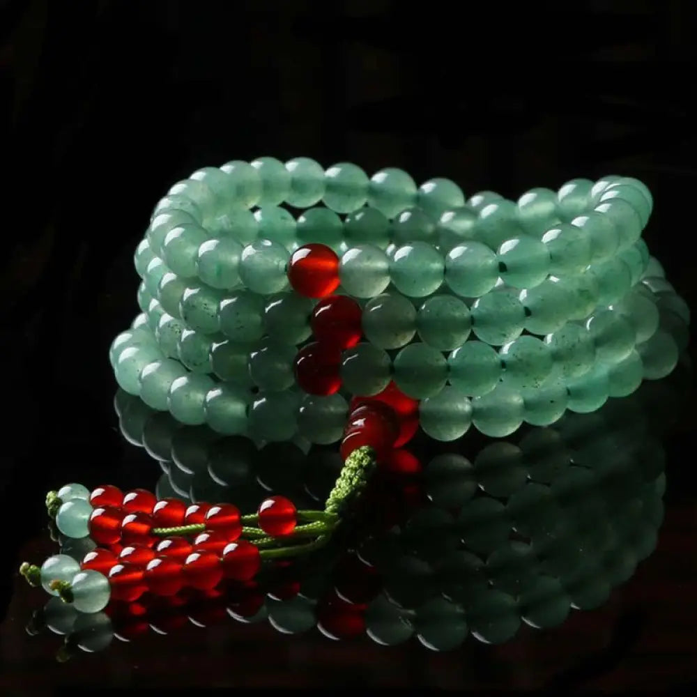 BWOOOH handcrafted 108-bead mala bracelet, showcasing polished 6mm green aventurine and red agate with a fine tassel, enhancing meditation & luck.