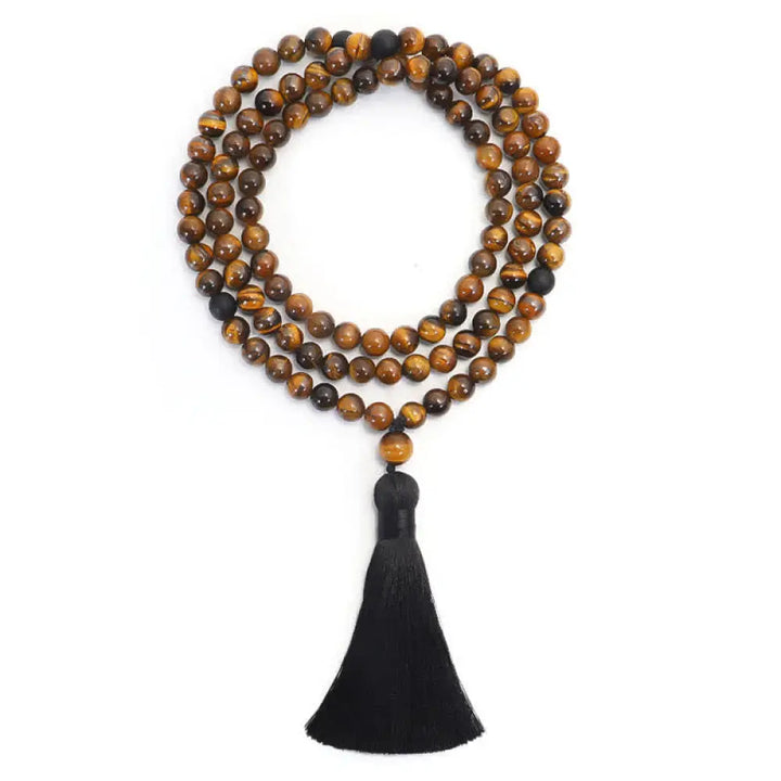 A BWOOOH 108-bead Tiger Eye protection mala bracelet with a matching tassel, showcased on a wrist for meditation and daily spiritual practice, emphasizing courage and positive energy. - View 7