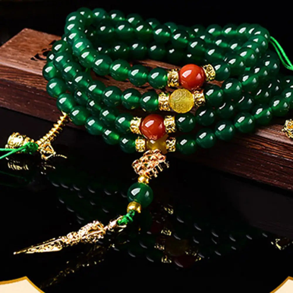 BWOOOH Natural Green Agate 108-bead Success Mala, depicted as a coiled bracelet, showcasing polished green agate stones for meditation, courage, and manifesting victory.