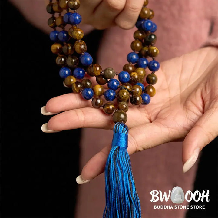 BWOOOH 108-bead mala bracelet featuring polished brown Tiger Eye and deep blue Lazurite Lapis Lazuli stones with a traditional tassel, symbolizing protection and wisdom for mindfulness. - View 5