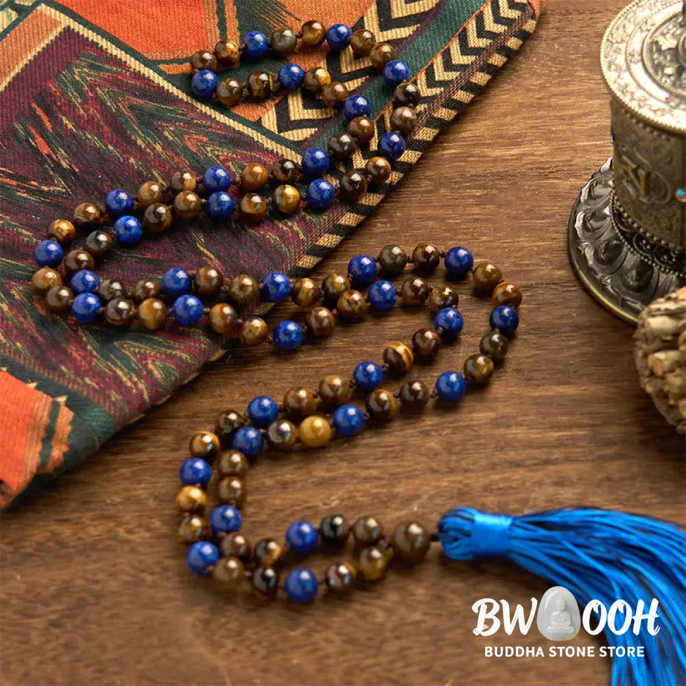 BWOOOH 108-bead mala bracelet featuring polished brown Tiger Eye and deep blue Lazurite Lapis Lazuli stones with a traditional tassel, symbolizing protection and wisdom for mindfulness. - View 3