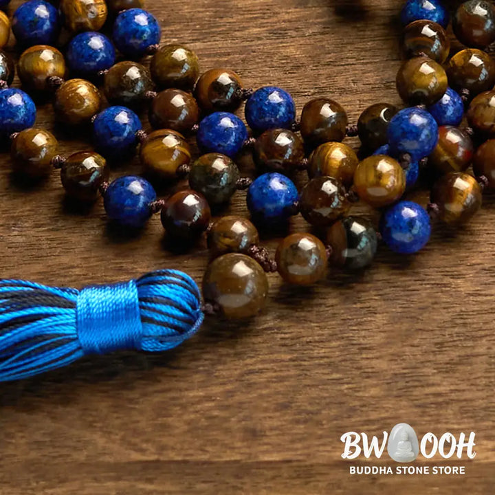 BWOOOH 108-bead mala bracelet featuring polished brown Tiger Eye and deep blue Lazurite Lapis Lazuli stones with a traditional tassel, symbolizing protection and wisdom for mindfulness. - View 6