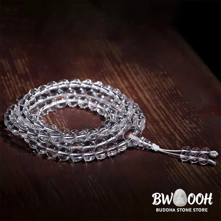 Close-up of BWOOOH 108 Clear Quartz Protection Mala, featuring polished 6mm or 8mm white crystal beads on elastic string, suitable for meditation and wrist wear. - View 5