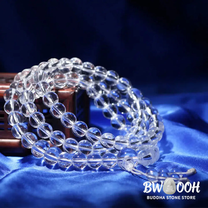 Close-up of BWOOOH 108 Clear Quartz Protection Mala, featuring polished 6mm or 8mm white crystal beads on elastic string, suitable for meditation and wrist wear. - View 4