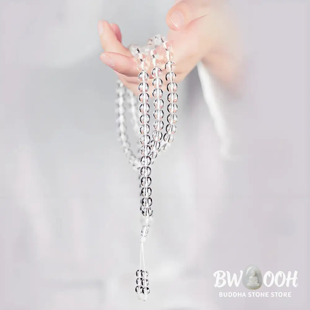 Close-up of BWOOOH 108 Clear Quartz Protection Mala, featuring polished 6mm or 8mm white crystal beads on elastic string, suitable for meditation and wrist wear. - View 9