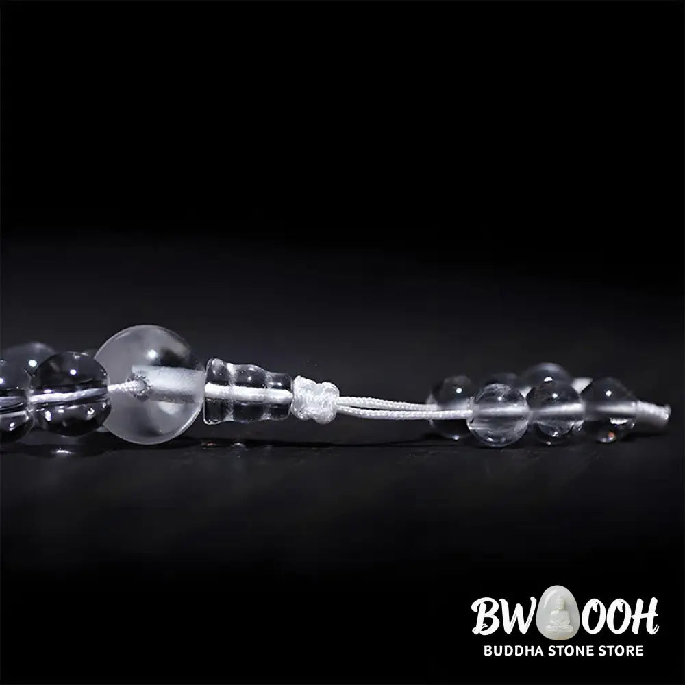 Close-up of BWOOOH 108 Clear Quartz Protection Mala, featuring polished 6mm or 8mm white crystal beads on elastic string, suitable for meditation and wrist wear. - View 12