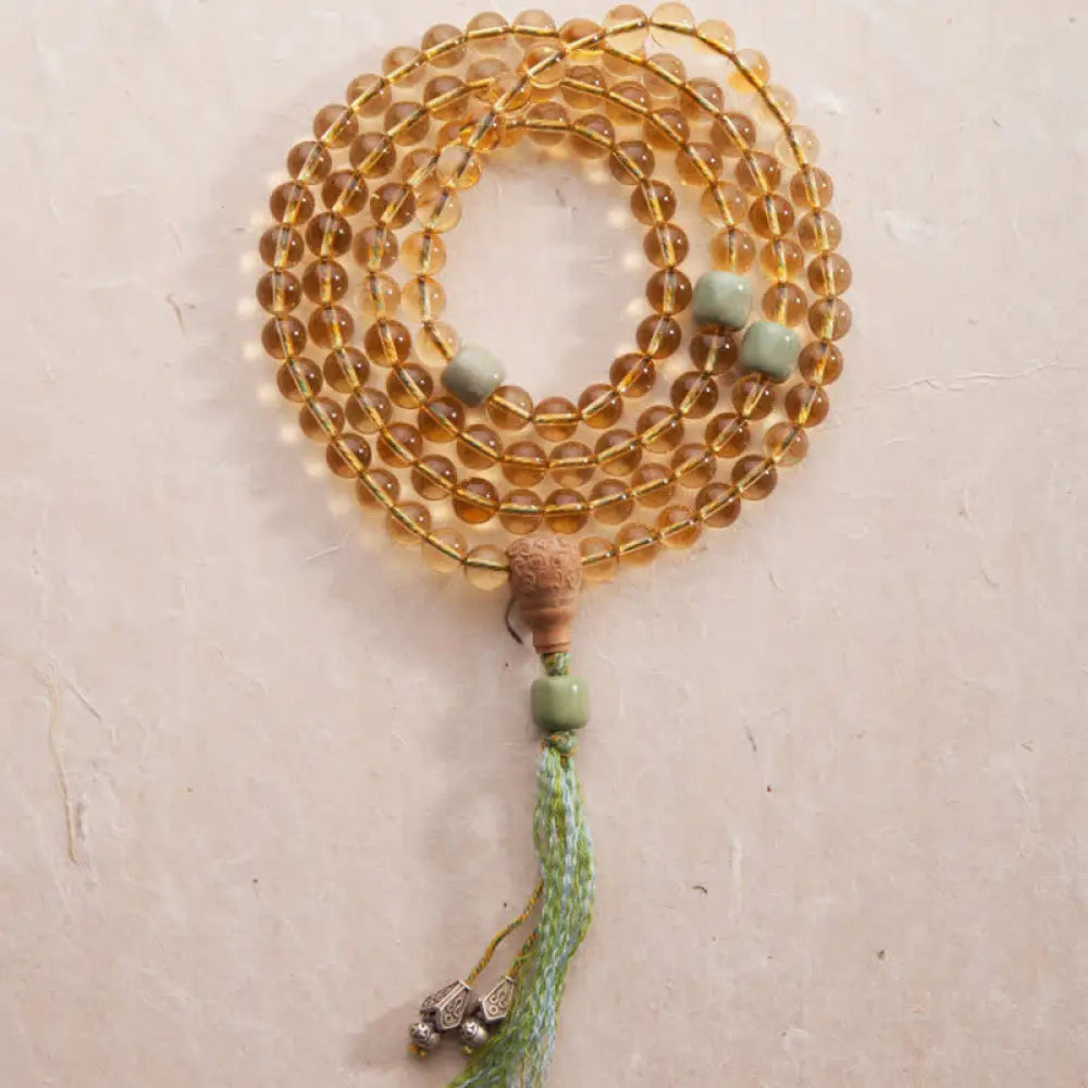 BWOOOH 108 Mala Protection Prosperity Bracelet featuring 6.5-7mm natural Citrine, Sandalwood, and Turquoise beads with 925 Sterling Silver accents on a premium elastic string, suitable for 15-16cm wrists. Ideal for mindfulness and spiritual balance.