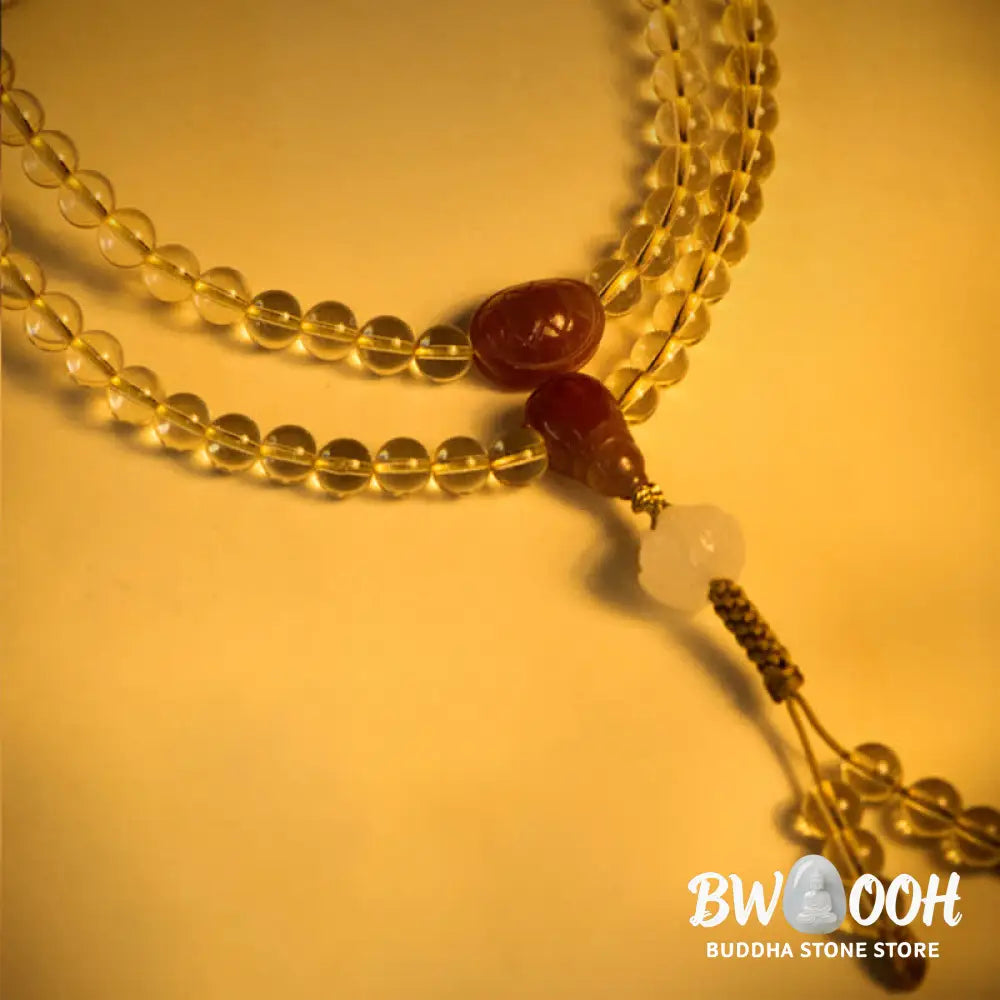 BWOOOH 108 Mala Beads bracelet, 6mm natural Citrine, Red Agate, White Jade, and 925 Sterling Silver beads. Features a sterling silver Lotus charm, symbolizing enlightenment and resilience. Elastic string, ideal for meditation and intention setting. - View 7