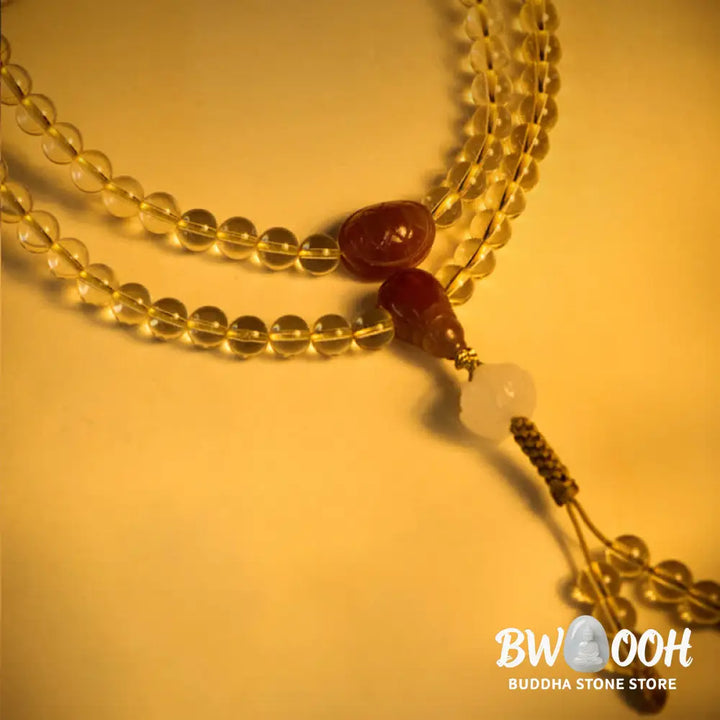 BWOOOH 108 Mala Beads bracelet, 6mm natural Citrine, Red Agate, White Jade, and 925 Sterling Silver beads. Features a sterling silver Lotus charm, symbolizing enlightenment and resilience. Elastic string, ideal for meditation and intention setting. - View 7