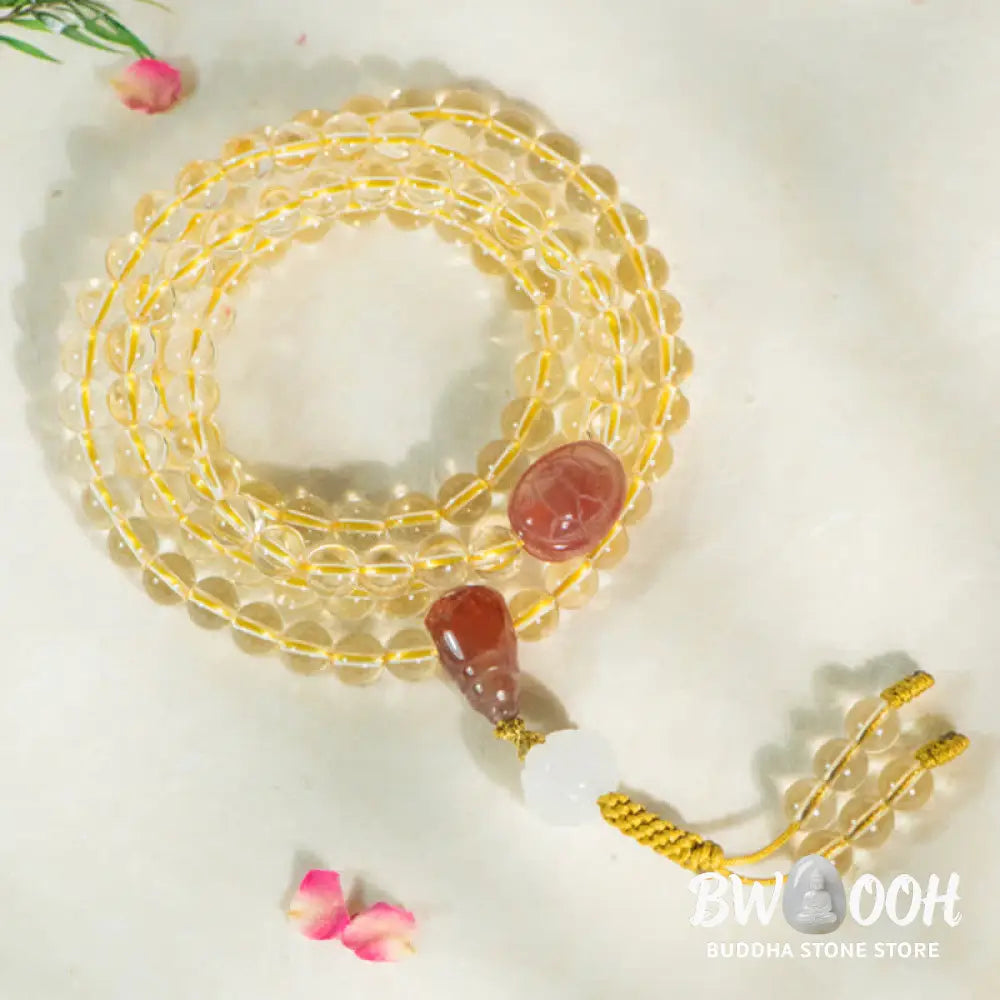 BWOOOH 108 Mala Beads bracelet, 6mm natural Citrine, Red Agate, White Jade, and 925 Sterling Silver beads. Features a sterling silver Lotus charm, symbolizing enlightenment and resilience. Elastic string, ideal for meditation and intention setting. - View 4