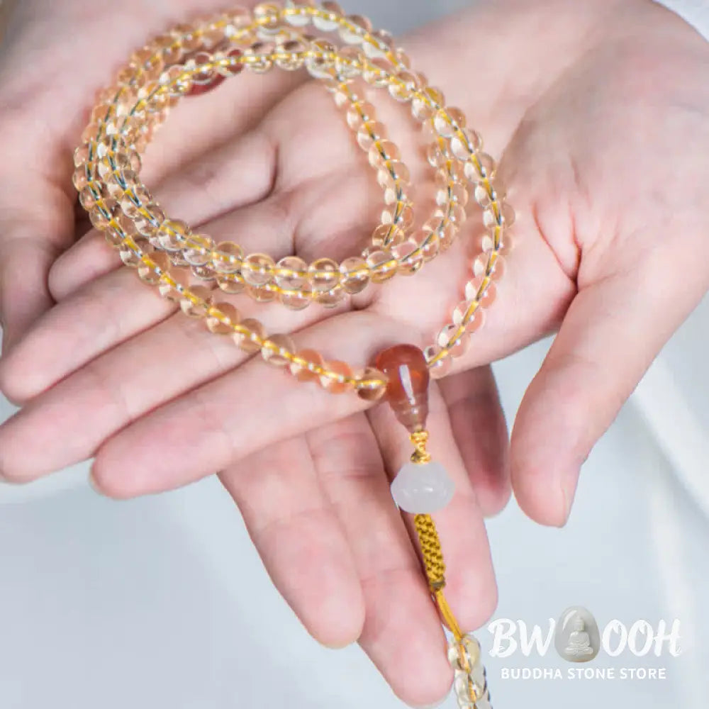 BWOOOH 108 Mala Beads bracelet, 6mm natural Citrine, Red Agate, White Jade, and 925 Sterling Silver beads. Features a sterling silver Lotus charm, symbolizing enlightenment and resilience. Elastic string, ideal for meditation and intention setting. - View 3