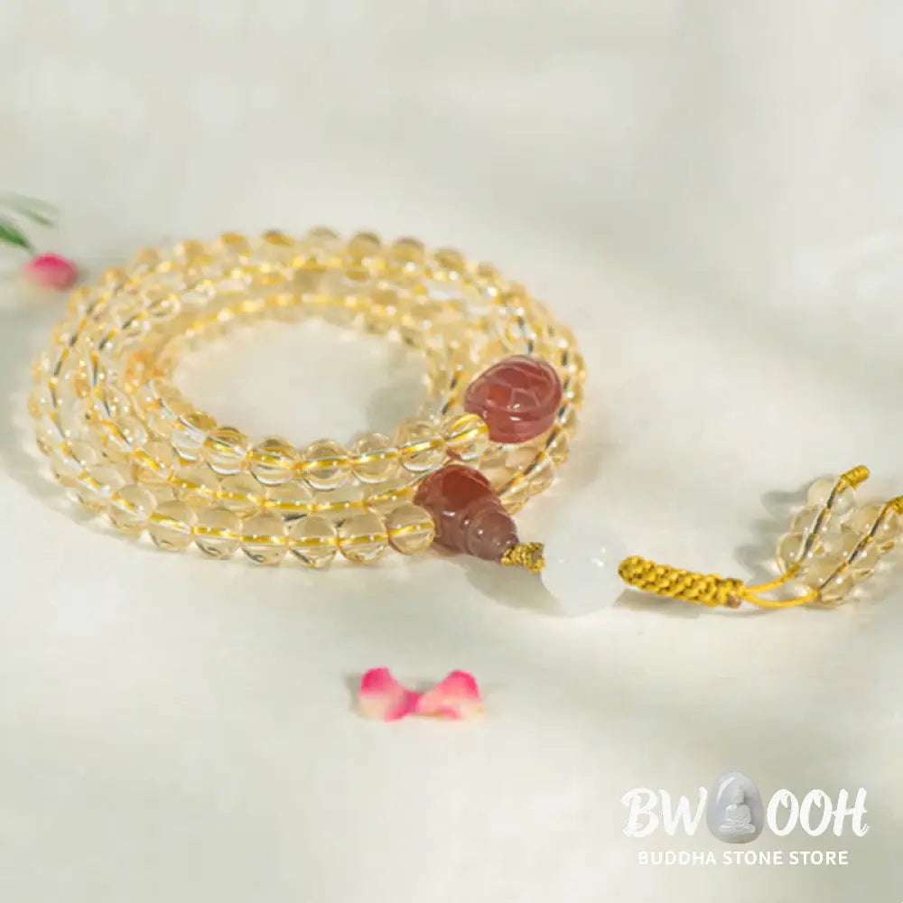 BWOOOH 108 Mala Beads bracelet, 6mm natural Citrine, Red Agate, White Jade, and 925 Sterling Silver beads. Features a sterling silver Lotus charm, symbolizing enlightenment and resilience. Elastic string, ideal for meditation and intention setting. - View 5