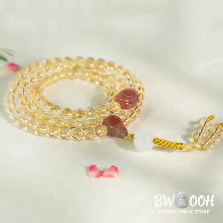BWOOOH 108 Mala Beads bracelet, 6mm natural Citrine, Red Agate, White Jade, and 925 Sterling Silver beads. Features a sterling silver Lotus charm, symbolizing enlightenment and resilience. Elastic string, ideal for meditation and intention setting. - View 5