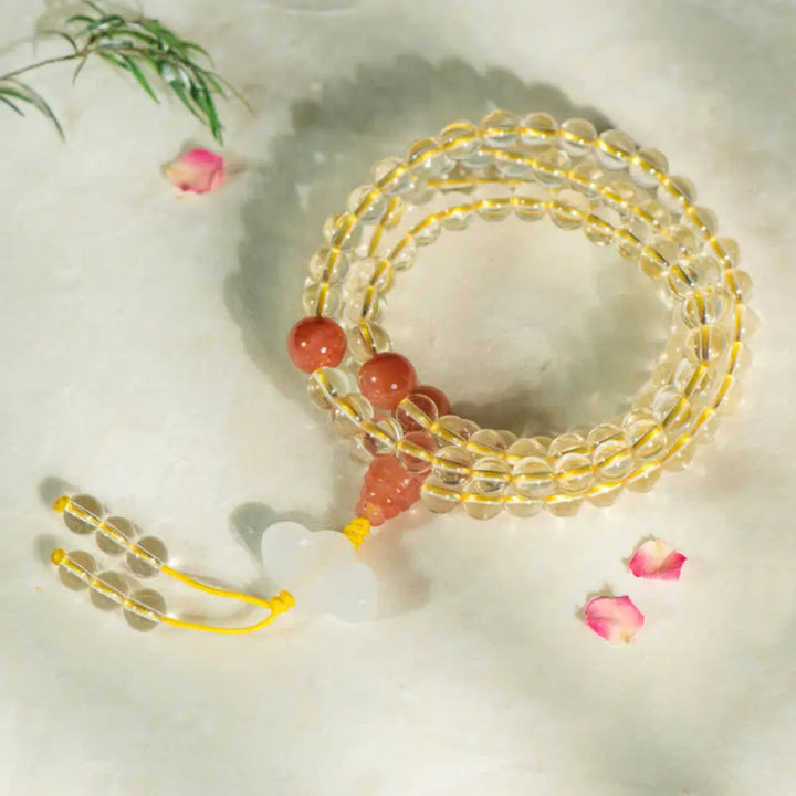 BWOOOH 108 Mala Beads bracelet, 6mm natural Citrine, Red Agate, White Jade, and 925 Sterling Silver beads. Features a sterling silver Lotus charm, symbolizing enlightenment and resilience. Elastic string, ideal for meditation and intention setting. - View 8