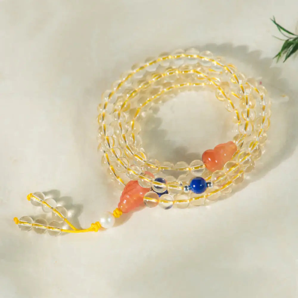 BWOOOH 108 Mala Beads bracelet, 6mm natural Citrine, Red Agate, White Jade, and 925 Sterling Silver beads. Features a sterling silver Lotus charm, symbolizing enlightenment and resilience. Elastic string, ideal for meditation and intention setting. - View 14