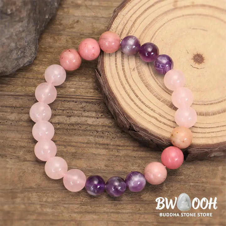 BWOOOH 108 Amethyst Rose Quartz Mala beads bracelet with a delicate tassel, handcrafted for meditation, stress relief, and fostering self-love and inner peace. The smooth purple Amethyst and soft pink Rose Quartz gemstones are clearly visible on a premium elastic string, ready to be worn as a bracelet or necklace. - View 5
