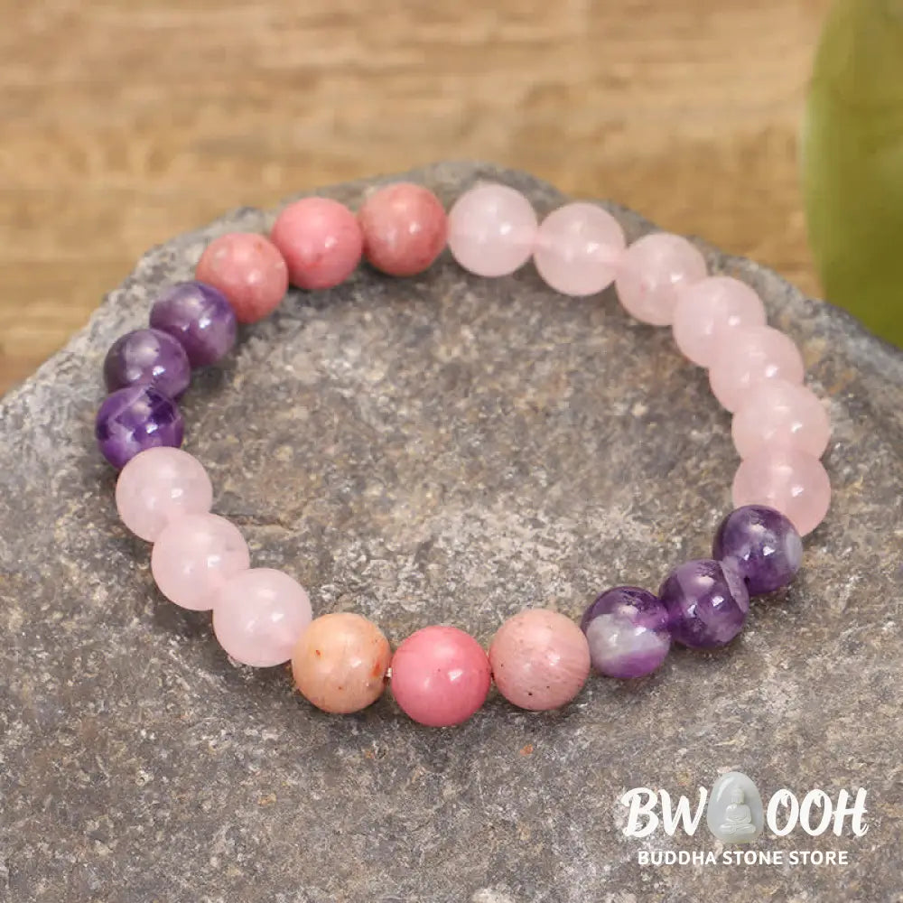 BWOOOH 108 Amethyst Rose Quartz Mala beads bracelet with a delicate tassel, handcrafted for meditation, stress relief, and fostering self-love and inner peace. The smooth purple Amethyst and soft pink Rose Quartz gemstones are clearly visible on a premium elastic string, ready to be worn as a bracelet or necklace. - View 6