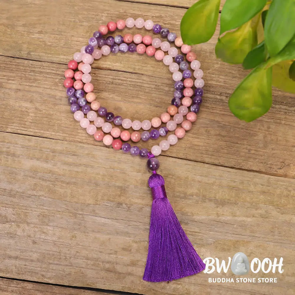 BWOOOH 108 Amethyst Rose Quartz Mala beads bracelet with a delicate tassel, handcrafted for meditation, stress relief, and fostering self-love and inner peace. The smooth purple Amethyst and soft pink Rose Quartz gemstones are clearly visible on a premium elastic string, ready to be worn as a bracelet or necklace. - View 9