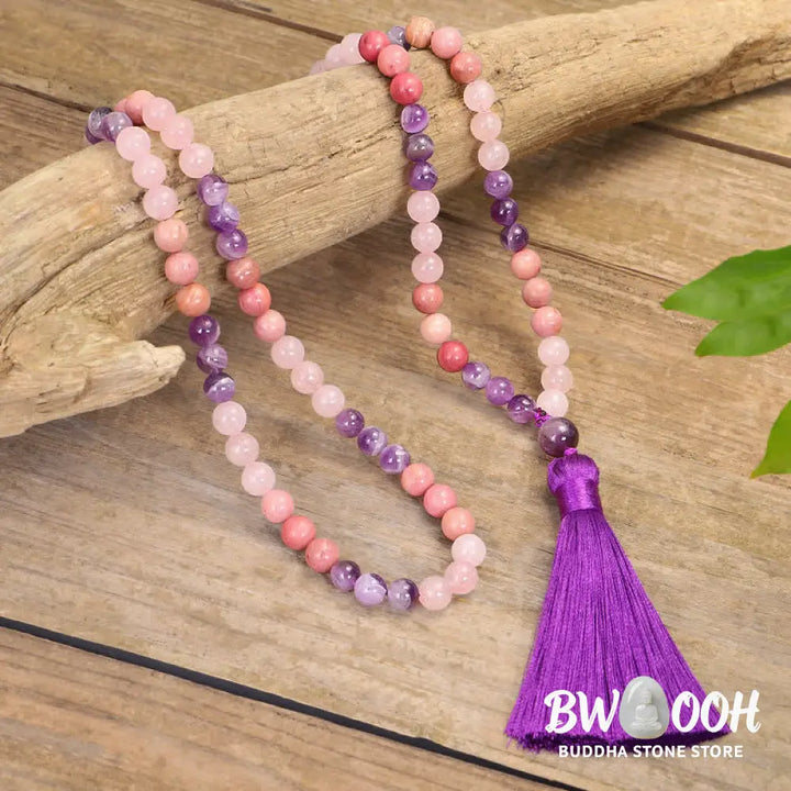 BWOOOH 108 Amethyst Rose Quartz Mala beads bracelet with a delicate tassel, handcrafted for meditation, stress relief, and fostering self-love and inner peace. The smooth purple Amethyst and soft pink Rose Quartz gemstones are clearly visible on a premium elastic string, ready to be worn as a bracelet or necklace. - View 2