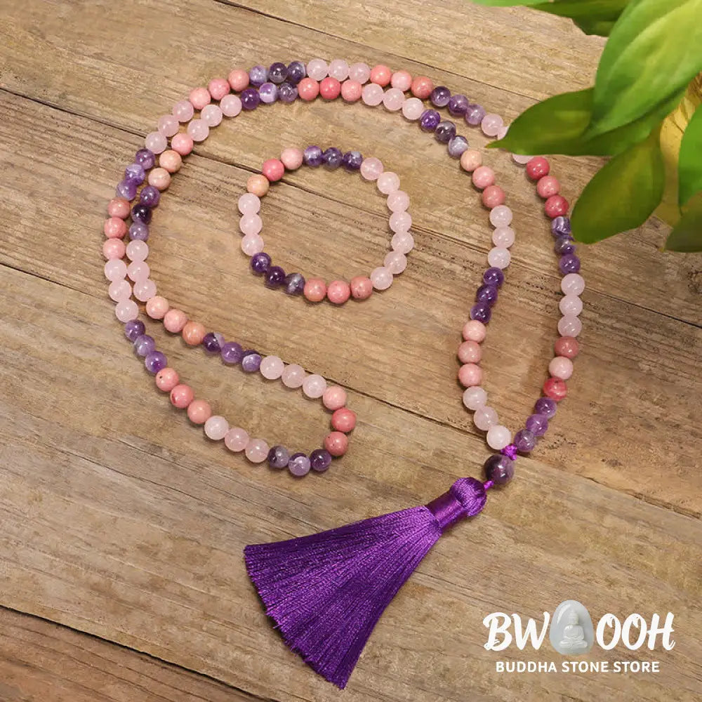 BWOOOH 108 Amethyst Rose Quartz Mala beads bracelet with a delicate tassel, handcrafted for meditation, stress relief, and fostering self-love and inner peace. The smooth purple Amethyst and soft pink Rose Quartz gemstones are clearly visible on a premium elastic string, ready to be worn as a bracelet or necklace. - View 3