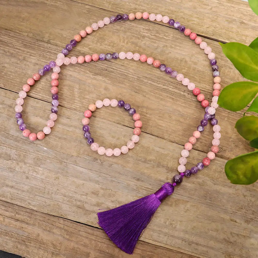 BWOOOH 108 Amethyst Rose Quartz Mala beads bracelet with a delicate tassel, handcrafted for meditation, stress relief, and fostering self-love and inner peace. The smooth purple Amethyst and soft pink Rose Quartz gemstones are clearly visible on a premium elastic string, ready to be worn as a bracelet or necklace.
