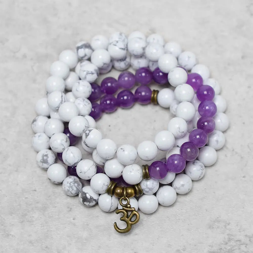 BWOOOH 108-bead Amethyst and White Turquoise OM Mala bracelet, featuring deep purple amethyst, serene white turquoise, and a central OM symbol on premium elastic string, designed for meditation, emotional balance, and spiritual healing.