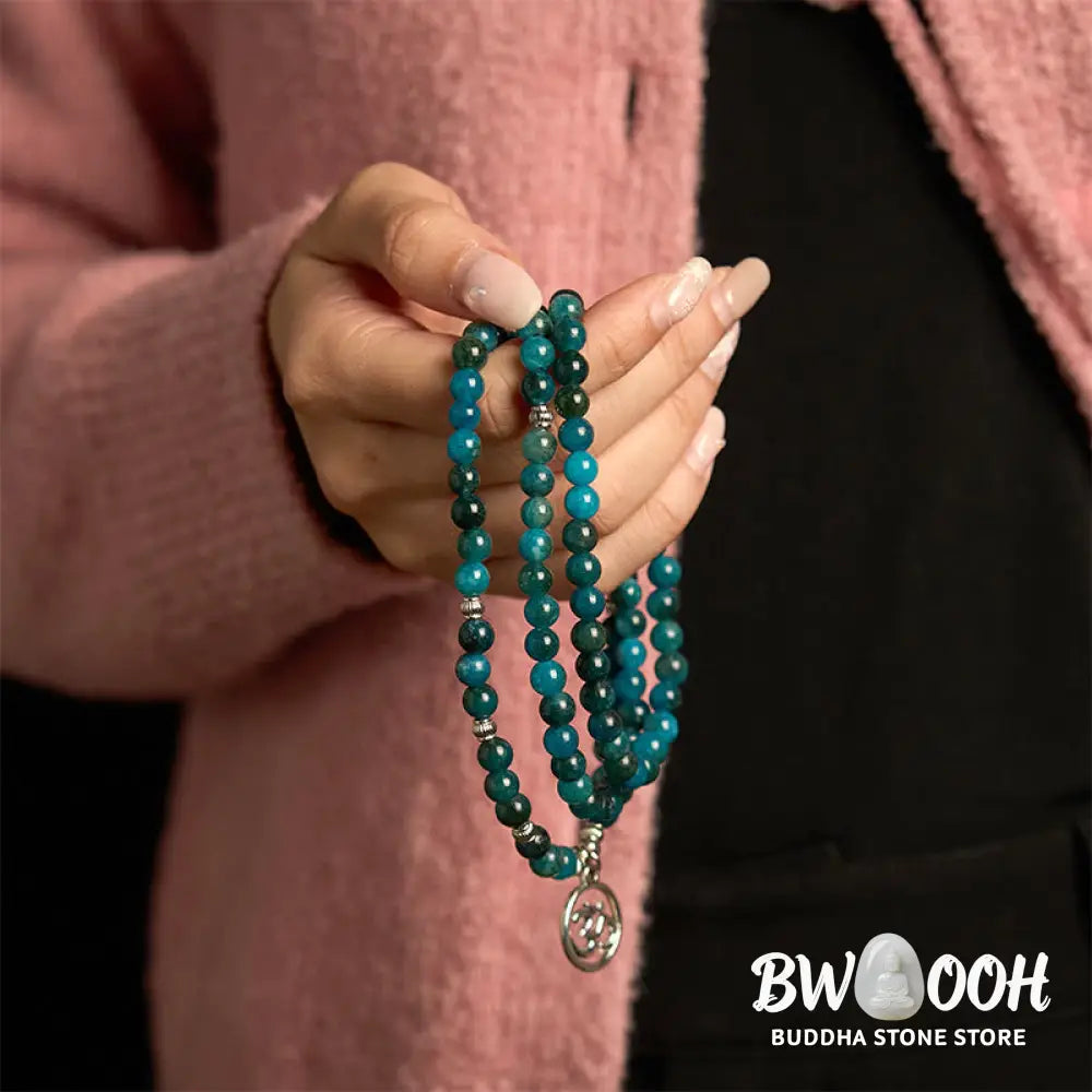 BWOOOH Apatite 108 Mala Beads bracelet with an intricate Om, Tree of Life, or Lotus pendant. This 6mm natural apatite bead mala is designed for meditation, spiritual clarity, and balancing inner energy. - View 2