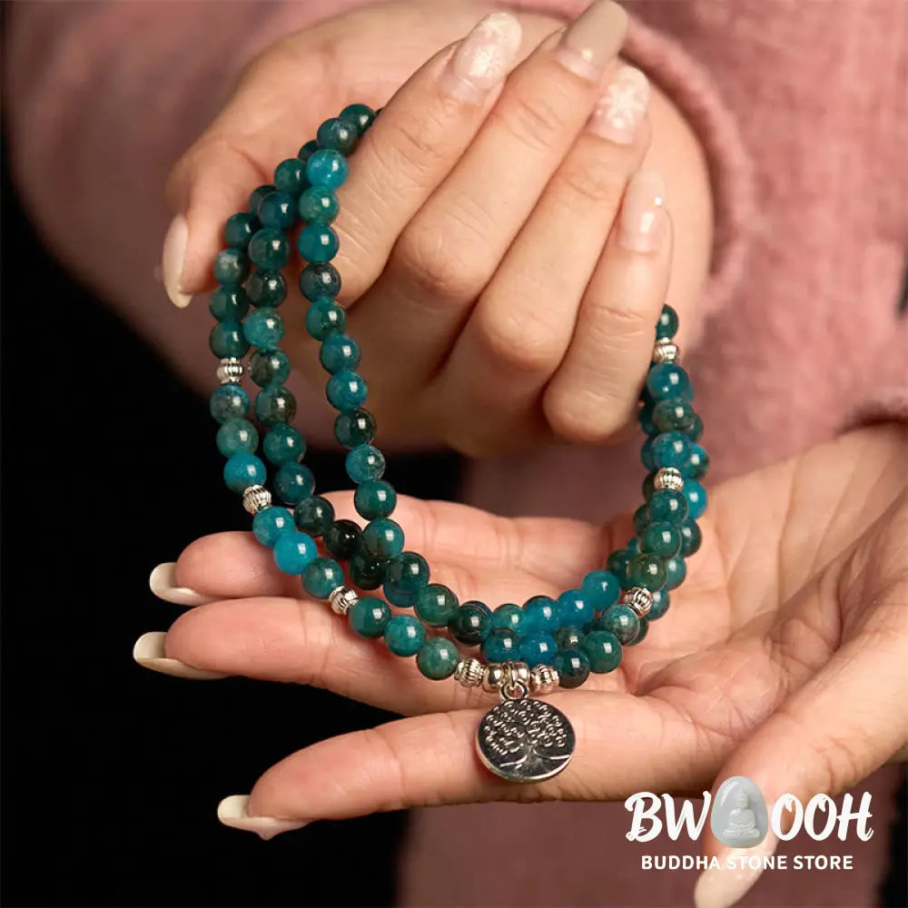 BWOOOH Apatite 108 Mala Beads bracelet with an intricate Om, Tree of Life, or Lotus pendant. This 6mm natural apatite bead mala is designed for meditation, spiritual clarity, and balancing inner energy. - View 9